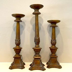 Pair of bronze-toned candlesticks, 19”-22” high